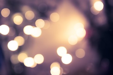 Vintage blue toned bokeh with blurred sparkling christmas lighting