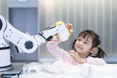 little Girl Building Robotic Arm At School