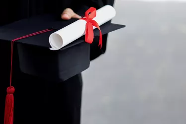 graduation,close up student holding hats and tassel Yellow gold in hand during commencement success graduates of the university,Concept education congratulation.Graduation Ceremony.