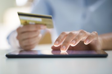 Woman is shopping online with digital tablet