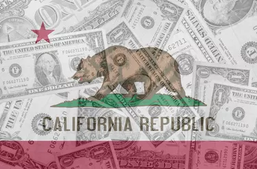 Can I Collect Social Security & CalPERS Together?US state of california flag with transparent dollar banknotes