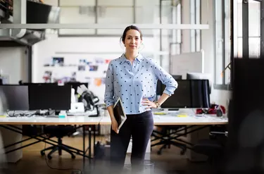 Businesswoman standing with digital tablet