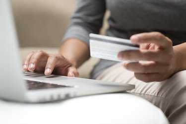 How Do I Retrieve Old Credit Card Statements?Close up of hands shopping online