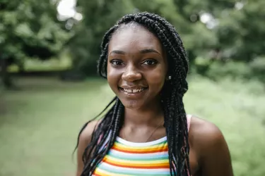 Outdoor portrait of pretty black teenager