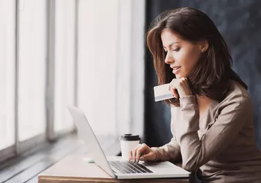 Woman is shopping online with laptop