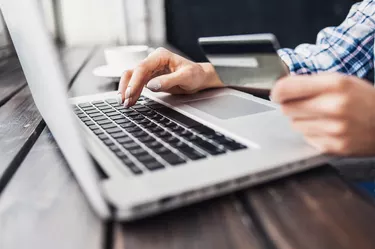 Woman is shopping online with laptop