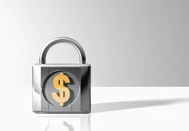 Can I Stop the IRS From Taking My Taxes for Child Support?Padlock with Dollar Symbol