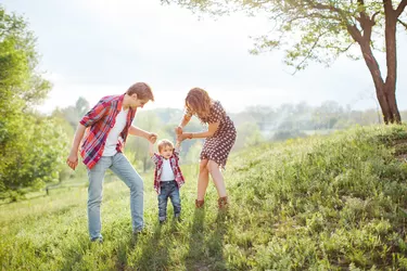 Happy Family Playing on the Nature