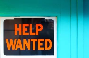 Help Wanted Sign in Old Blue Window