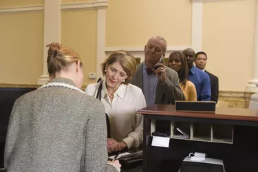 People waiting in line at bank