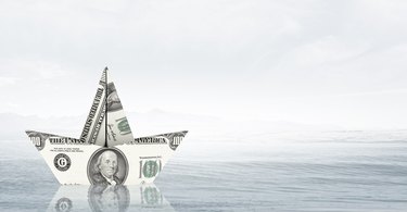 What Is a Liquid Bank Account?                    Dollar paper boat . Mixed media