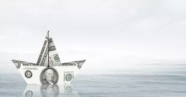What Is a Liquid Bank Account?                    Dollar paper boat . Mixed media