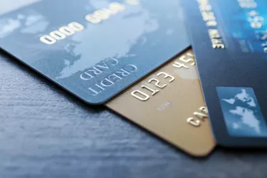 Different credit cards on table, closeup