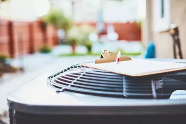 Air conditioner with clipboard and paper