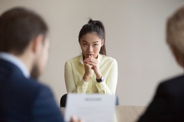 Nervous Asian applicant stressed at job interview