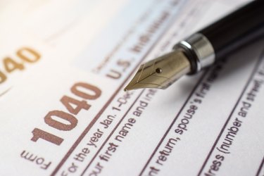 Tax form business financial concept with pen