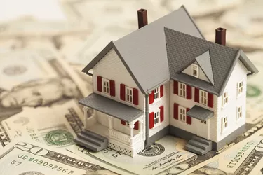 What Is an Escrow Number?                   Single family house on pile of money