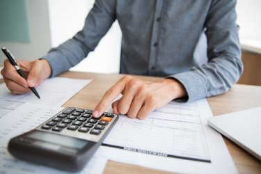 Accountant examining financial report