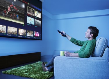 Man watching television in living room