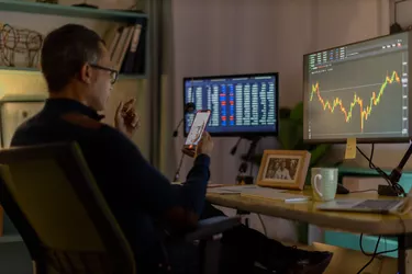 Currency trader on video call from his home office