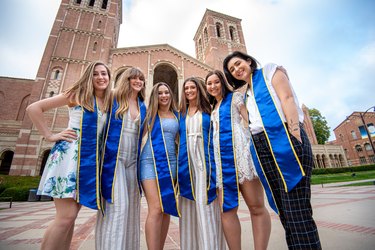 College Girls Pose Wearing Sashes for Graduation Photo