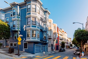 Residential street with Victorian style apartment buildings on a sunny day, San Francisco, California, USA