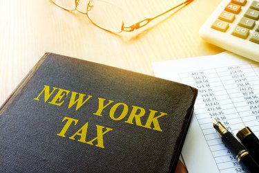 Book with title New York tax and calculator.