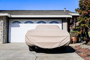 Covered car in a driveway