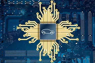An illustration representing a computer circuit board and a car chip.