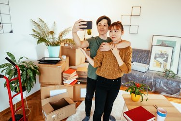 Japanese couple moving out and taking selfie before leaving