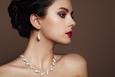 Fashion portrait of young beautiful woman with jewelry.
