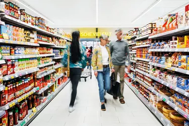 Busy Supermarket Aisle With Customers