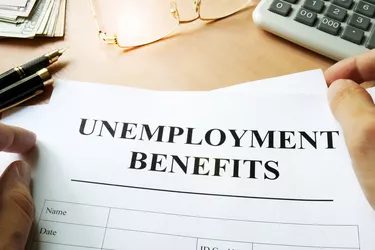 Unemployment benefits form on a table.