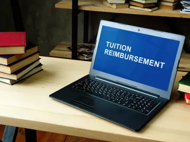 Laptop with information about Tuition Reimbursement.