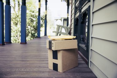 Stack of packages on front porch after mail delivery