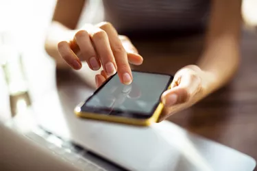 Young woman using an app on her smartphone