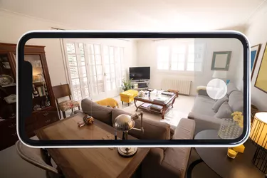 Visiting home interior using mobile phone with virtual reality technology.