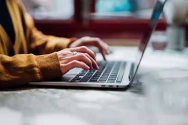 Closeup Shot Of An Woman Using Laptop