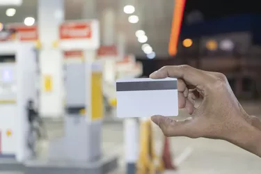 Credit card to make a payment for refueling car on gas station.