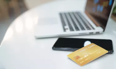 Credit card on keyboard with laptop. Online payment for purchases from online stores. Online shopping.