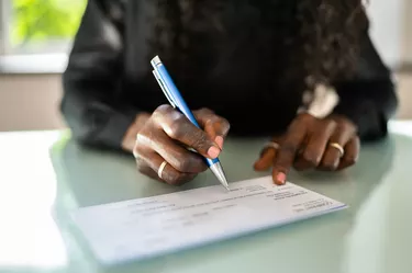 African Woman Writing Check