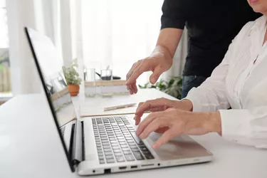 Woman working on laptop at the table