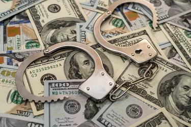 Iron handcuffs on 100 us dollar