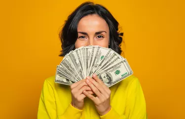 Happy woman with money