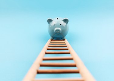 Piggy Bank Climbing a Stair