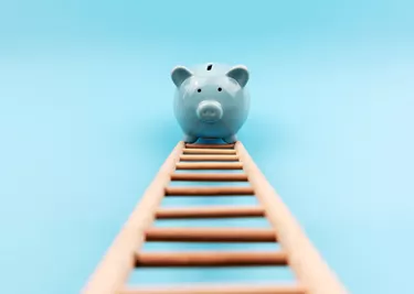 Piggy Bank Climbing a Stair