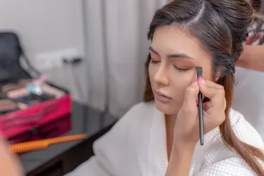 Makeup artist doing bridal makeup