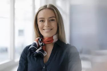 Portrait of smiling young stewardess