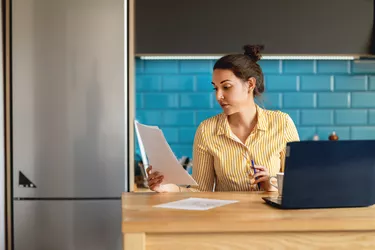 Woman Doing Finances at Home