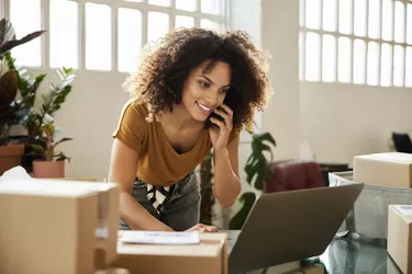 Entrepreneur Using Laptop At Home Office